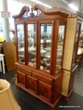 (R2) GLASS FRONT CHINA CABINET; 2 PC CHINA CABINET WITH A BEAUTIFUL CARVED BROKEN ARCH PEDIMENT TOP