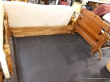 (R3) TWIN SIZE BED; WOODEN TWIN SIZED BED FRAME WITH A HEART SHAPE CARVED INTO THE TOP OF THE FOOT