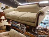 (R3) VINTAGE 3 CUSHION SOFA; HAS AN ARCHED BACK WITH CURTAIN CARVINGS AND REEDED DETAILING. HAS