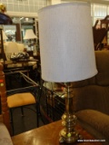 (R3) TABLE LAMP; BRASS TURNED TABLE LAMP THAT COMES WITH A WHITE WITH BROWN LINES, DRUM LAMP SHADE.