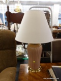 (R3) TABLE LAMP; PINK TABLE LAMP WITH A BRASS STAND AND TOP WITH A WHITE COOLIE LAMP SHADE. MEASURES