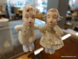 (R1) PAIR OF KISSING FIGURINES; 2 PIECE LOT OF MATCHING FIGURINES THAT KISS EACH OTHER. MEASURES 4.5