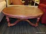 (R3) OVAL COFFEE TABLE; PINK PAINTED, OVAL, WOODEN COFFEE TABLE WITH 4 TURNED LEGS AND AN X