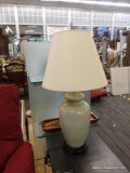 (R3) TABLE LAMP; GREEN CRACKLE POTTERY TABLE LAMP SITTING ON A BLACK PAINTED WOODEN STAND WITH A