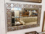 (WALL) WALL HANGING MIRROR; RECTANGULAR MIRROR WITH A SILVER PAINTED FRAME THAT HAS RED FLOWERS AND