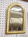 (WALL) WALL HANGING MIRROR; ARCHED TOP MIRROR WITH A GOLD TONE AND ORANGE STONE INLAY FRAME.