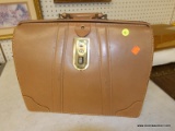 (WALL) COWHIDE BRIEFCASE; IS LIGHT BROWN IN COLOR. GREAT FOR TRANSPORTING FILES! HAS SOME DAMAGE TO