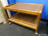(BWALL) WOODGRAIN MICROWAVE/TV CART; RECTANGULAR ROLLING CART WITH LOWER SHELF. MEASURES 2 FT 3.5 IN