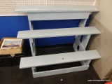 (BWALL) WOODEN DISPLAY SHELF; LIGHT BLUE PAINTED 3 TIERED WOODEN DISPLAY SHELF. MEASURES 4 FT X 2 FT