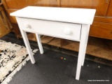(R1) ACCENT TABLE; WHITE PAINTED WOODEN SOFA/ACCENT TABLE WITH A SINGLE DRAWER. MEASURES 29.5 IN X