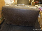 (TABLE) VINTAGE AMERICAN TOURISTER SUITCASE; LARGE DARK BROWN HARD-SHELL SUITCASE WITH FRONT MEAL