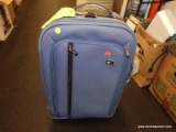 (TABLE) SUIT CASE; TOMMY HILFIGER BLUE SUITCASE WITH A TAN INTERIOR. IN GOOD CONDITION. HAS 2 WHEELS