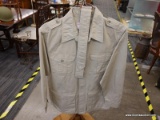 (COAT RACK) BUTTON UP SHIRT AND PANTS; TAN GENUINE FILSON GARMENT BUTTON UP SHIRT AND PANTS. MEDIUM