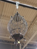 CHANDELIER; BRONZE TONED FIXTURE WITH SCROLLING DETAILS AND A CAGE LIKE BODY. MEASURES APPROXIMATELY