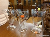 (R2) LOT OF GLASSES; 3 PIECE LOT OF SWIRL SHAPED GLASSES WITH A RIDE STRIPE THROUGH IT. MEASURES 6.5