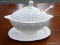 (R2) SOUP TUREEN; VINTAGE EGG SHAPED SOUP TUREEN ON A PEDESTAL WITH SHELL DETAILING, A SPOON, AND AN