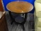(R3) END TABLE; ROUND, WOODEN END TABLE WITH THE TABLE TOP GRAIN POINTING INWARD. SITS ON 3 BLACK