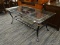 (R3) COFFEE TABLE; BLACK METAL COFFEE TABLE WITH BEVELED GLASS TOP WITH 1 IN BEVEL. HAS A SINGLE