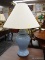 (R3) TABLE LAMP; 1 OF A PAIR OF BLUE URN SHAPED TABLE LAMPS WITH BELL SHAPED SHADES AND BRASS