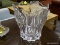(R3) CRYSTAL VASE; LARGE CRYSTAL FLOWER THEMED VASE. IS IN EXCELLENT CONDITION AND MEASURES 9 IN