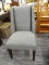(R3) TUXEDO STYLE SIDE CHAIR; HAS A GRAY CHEVRON PATTERN UPHOLSTERY AND BLOCK STYLE LEGS. IS IN GOOD