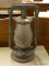 (R3) ANTIQUE OIL LANTERN; HAS THE ORIGINAL GLASS GLOBE AND IS IN GOOD CONDITION. MEASURES 14 IN TALL