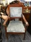 (R4) VICTORIAN ARMCHAIR; HAS BLUE UPHOLSTERY AND IS IN GOOD CONDITION. MEASURES 20 IN X 25 IN X 36