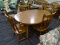 (R4) TABLE AND CHAIRS; INCLUDES A ROUND TABLE WITH A 12 IN LEAF AND 4 MATCHING CHAIRS WITH TURNED