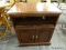 (R4) TV STAND; MAHOGANY TV STAND WITH SWIVEL TOP, OPEN STORAGE AREA, AND 2 LOWER DOORS WITH BRASS