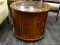 (R4) DRUM TABLE; CHERRY DRUM TABLE WITH LEATHER TOP AND GOLD TOOLING ALONG THE EDGES WITH 1 LOWER