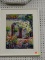 (BACK WALL) FRAMED CROSS-STITCHING; DEPICTS A LUSH GARDEN SCENE IN VIBRANT COLORS HAS WHITE MATTING