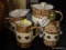 (WALL) LOT OF SPONGEWARE; INCLUDES A BROWN LAMP AND A SET OF 3 GRADUATED BROWN PITCHERS. TOTAL OF 4