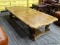 (R1) WOODEN COFFEE TABLE; 3 PANELED WOODEN COFFEE TABLE WITH CARVED LEAF DETAILINGS ON 2 ENDS AND