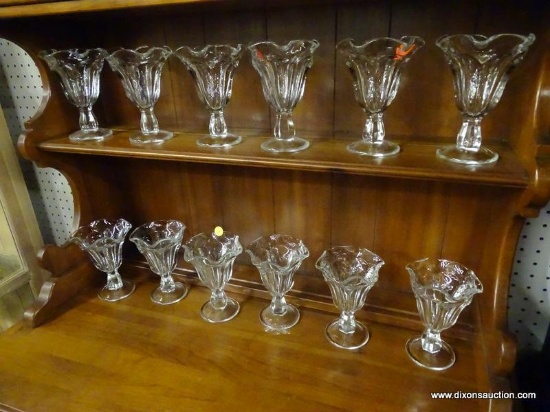 (R1) DESSERT GLASSES; 12 PIECE LOT OF SCALLOP RIMMED CLEAR GLASS DESSERT GLASSES. 6.25 IN TALL.