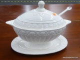 (R2) SOUP TUREEN; VINTAGE EGG SHAPED SOUP TUREEN ON A PEDESTAL WITH SHELL DETAILING, A SPOON, AND AN