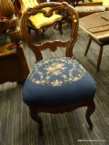 (R2) NEEDLE POINT CHAIR; BLUE UPHOLSTERED NEEDLE POINT CHAIR WITH A FLORAL DESIGN AND A CARVED ROUND