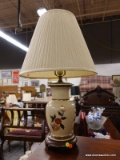 (R2) TABLE LAMP; PORCELAIN TABLE LAMP WITH HAND PAINTED FLORAL SCENE. SITS ON A WOODEN STAND AND