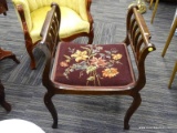 (R2) VINTAGE STOOL; BURGUNDY FLORAL NEEDLEPOINT STOOL WITH 2 BANNISTER SIDES. SITS ON 4 CABRIOLE