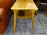 (R2) MID-CENTURY MODERN TABLE; WOODEN COFFEE TABLE WITH A LOWER SHELF AND ROUNDED/SQUARISH LEGS.