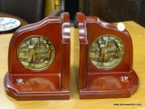 (R2) BOOK ENDS; PAIR OF WOODEN BOOKENDS WITH A DECORATIVE PIN OF A MAN AND WOMAN ON A GOLF COURSE,