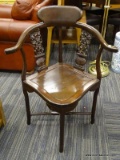(R3) CORNER CHAIR; HEAVILY CARVED ANTIQUE CORNER CHAIR WITH POTTED FLOWER MOTIF FOR THE BACKS. IS IN