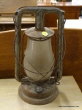 (R3) ANTIQUE OIL LANTERN; HAS THE ORIGINAL GLASS GLOBE AND IS IN GOOD CONDITION. MEASURES 14 IN TALL