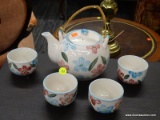 (R4) TEA SET; INCLUDES A FLORAL HAND PAINTED TEAPOT WITH 4 MATCHING TEA CUPS. ALL ARE IN EXCELLENT