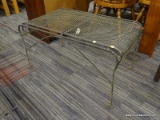 (R4) METAL AND MESHED WIRE PATIO TABLE; CAST IRON AND MESHED WIRE PATIO TABLE. IS IN VERY GOOD