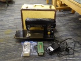 (R4) SEWING MACHINE; SINGER SEWING MACHINE IN A BROWN AND YELLOW CARRYING CASE. IS IN VERY GOOD