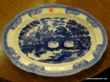 (R4) BLUE AND WHITE SERVING PLATTER; DEPICTS A BRIDGE SCENE WITH A SMALL VILLAGE IN THE BACKGROUND.