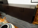 (BACK WALL) CREDENZA; 4 DOOR CREDENZA WITH 1 INTERIOR DRAWER (DRAWER CONTAINS A RAY BANS SUNGLASSES