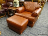 (R2) LEATHER SOFA CHAIR AND OTTOMAN; RUST COLORED LEATHER SOFA CHAIR WITH A MATCHING OTTOMAN, BOTH