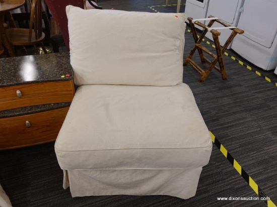 (R1) ARMLESS SOFA CHAIR; WHITE FABRIC ARMLESS CHAIR WITH A BACK CUSHION, SEAT CUSHION, AND SKIRT.