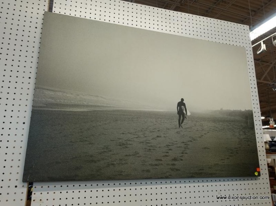 (R1) PRINT ON CANVAS; SHOWS A SURFER HOLDING HIS SURFBOARD WALKING DOWN A VACANT AND FOGGY BEACH.